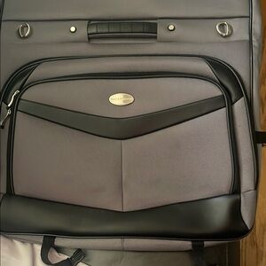 Black and Gray Travel Bags with Metal Accents
